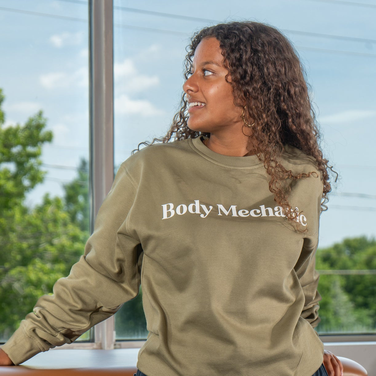 “Green Body Mechanic sweatshirt by Cardon Rehab designed for physiotherapists, massage therapists, chiropractors, and osteopaths.”